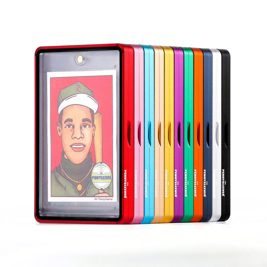 A set of colorful Color Frame protective 35pt Magnetic Card Holder Aluminum Cases displayed in a row, with one red case in front holding a custom The Pennysleever's card insert. The protective aluminum cases are shown in multiple colors including red, pink, light blue, gold, yellow, green, purple, orange, dark blue, silver and black, all on a clean white background.