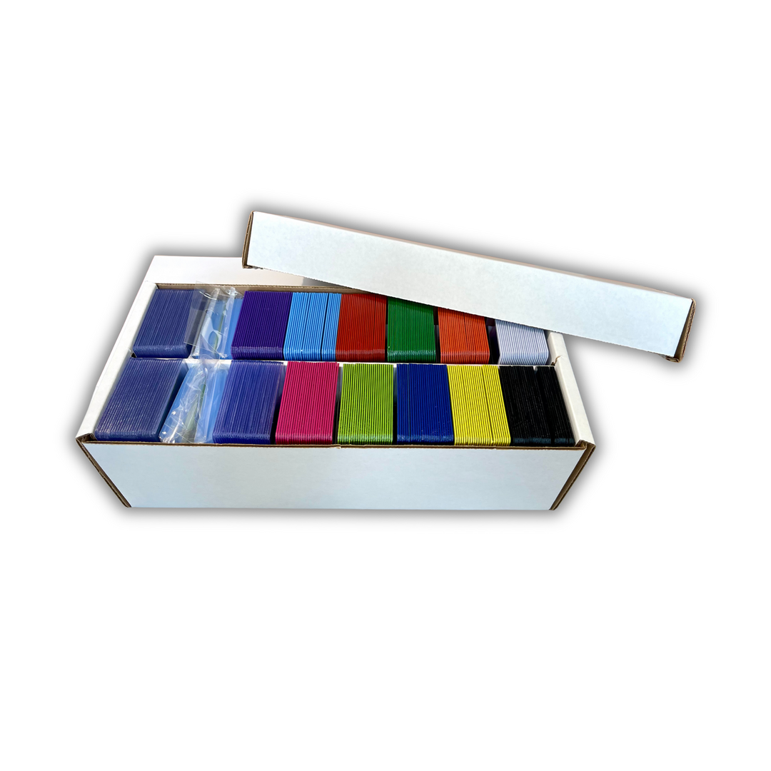 An open white cardboard box containing multiple Color Frame toploaders arranged in rows, with the lid leaning against the box on a plain white background.