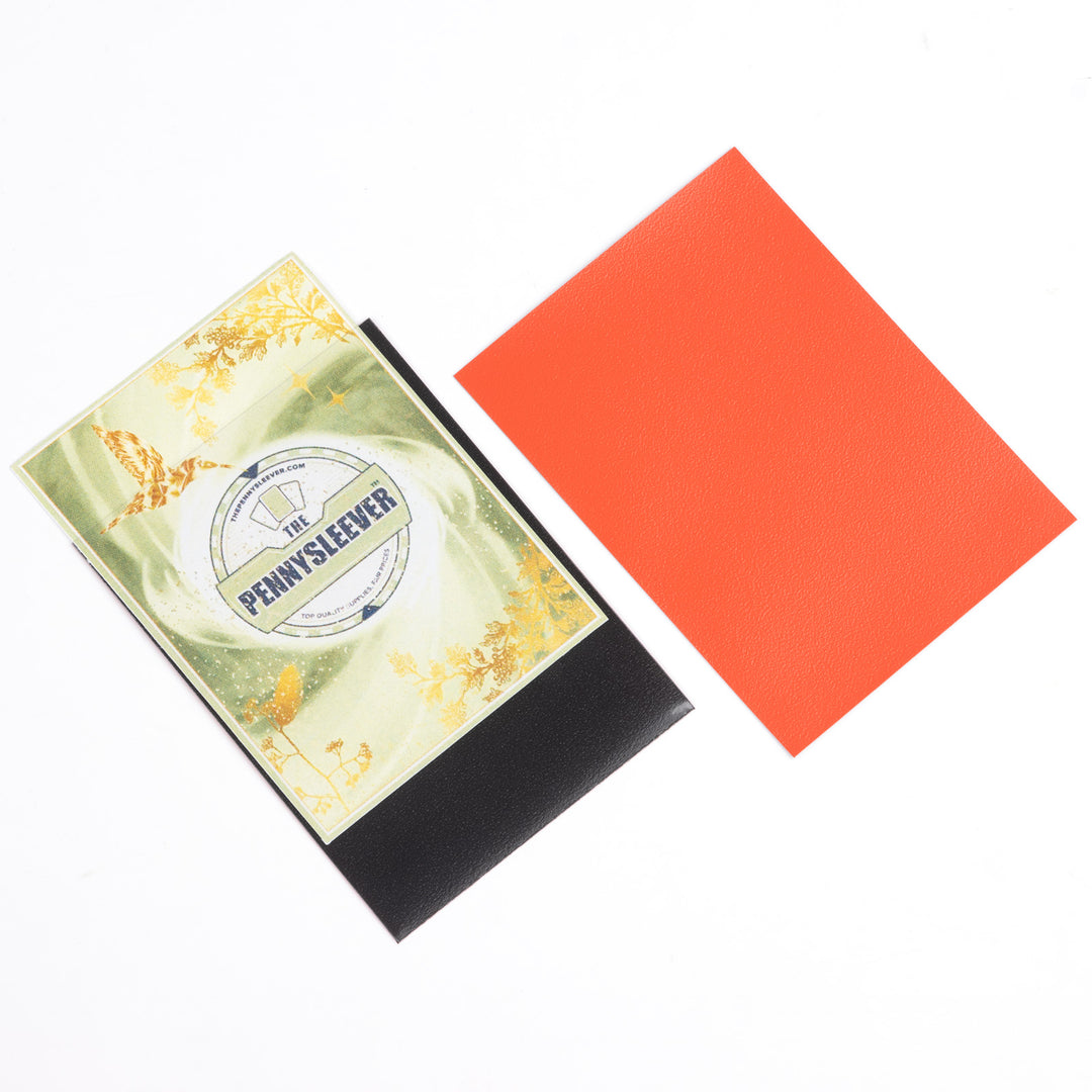 Packaging of 'The PennySleever' with a red deck protector on a white background