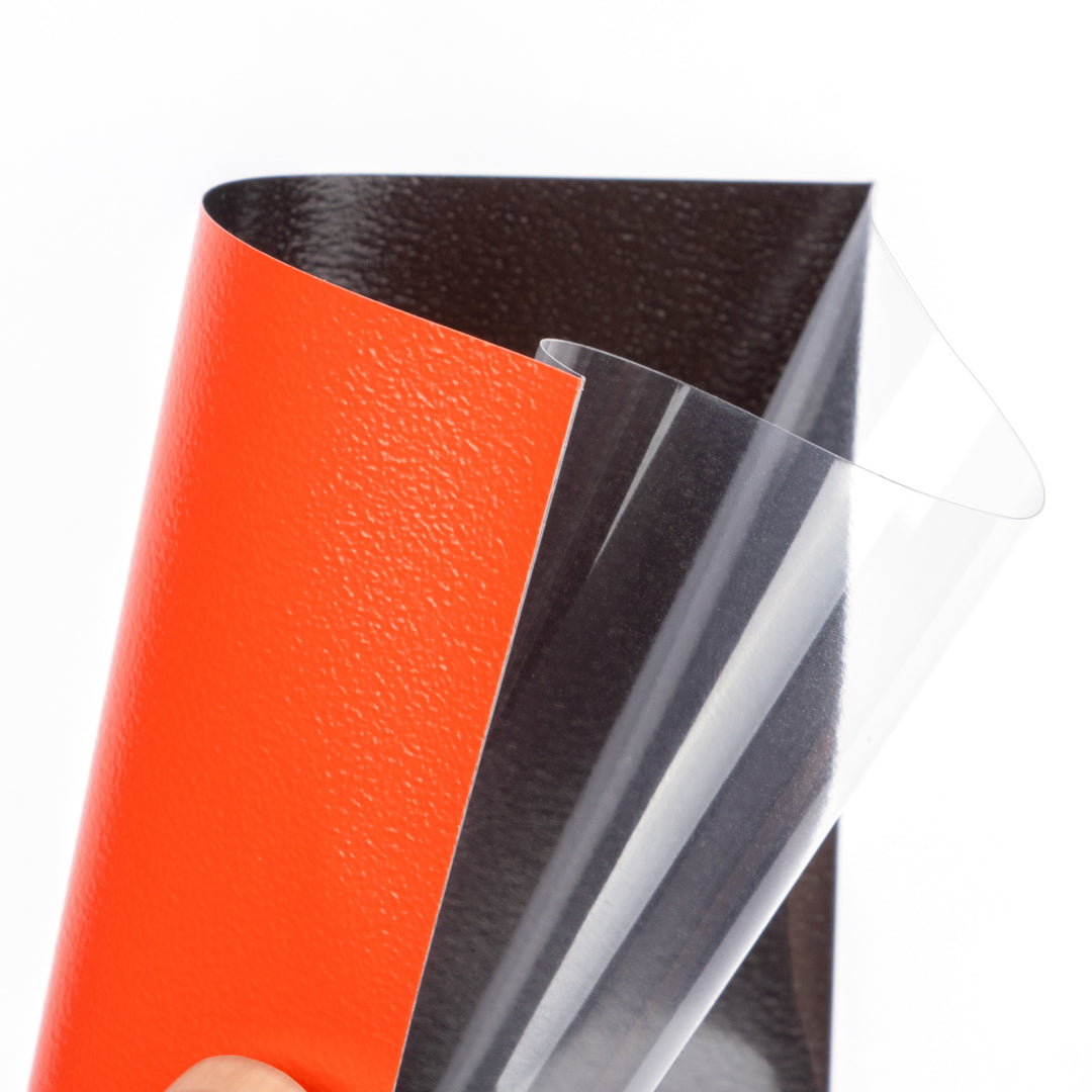 Close-up of a red deck protector from The Pennysleever