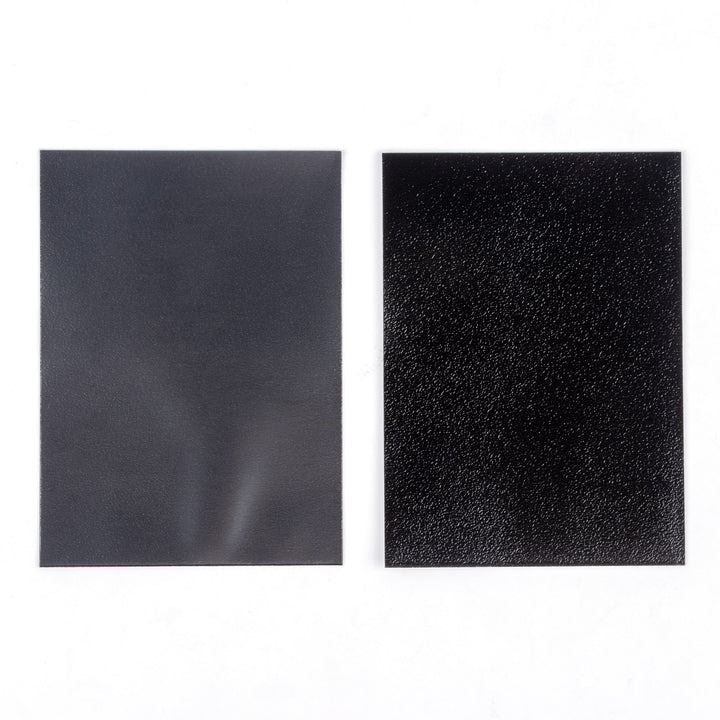 The smooth and matte sides of a deck protector on a white background