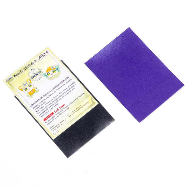 Trading card with a purple deck protector on a white background