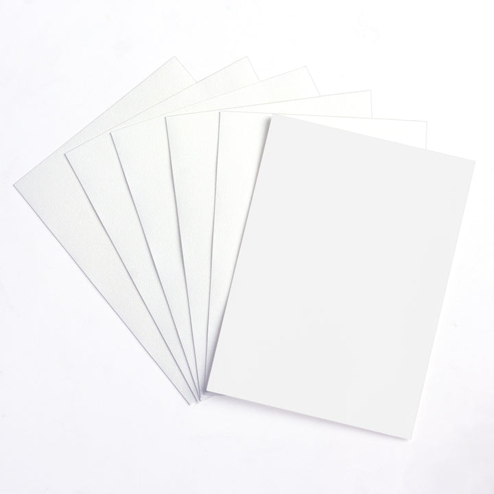 Five white matte deck protector sleeves on a white background