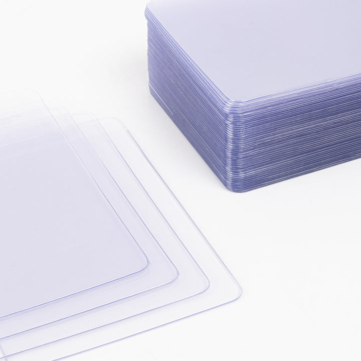 Large stack of semi-rigid card holders.