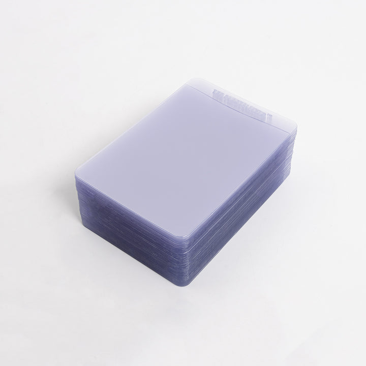 Stack of semi-rigid card holders against a white background.