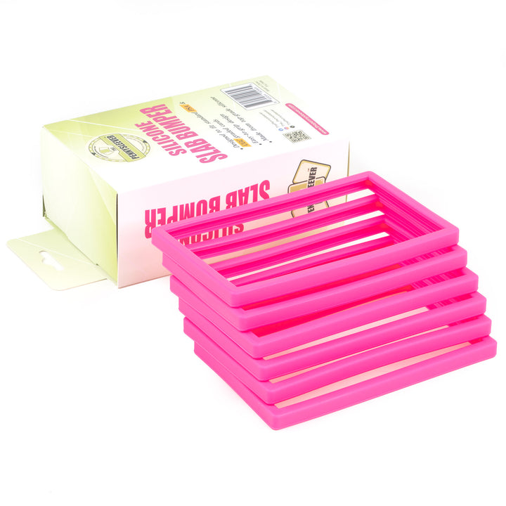 Stack of pink silicone slab bumpers with a box on a white background