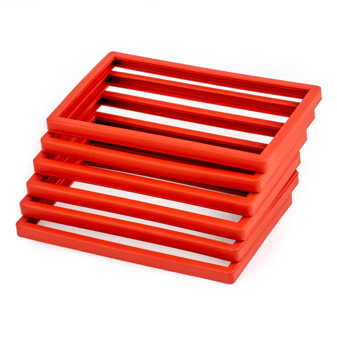 Stack of red silicone bumpers on a white background