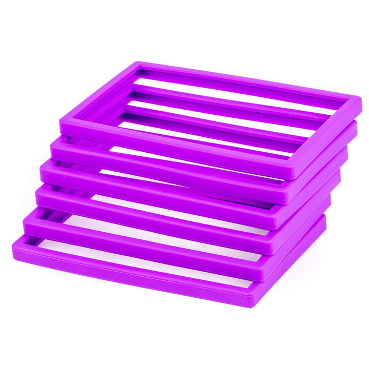 Stack of purple silicone slab bumpers
 on a white background
