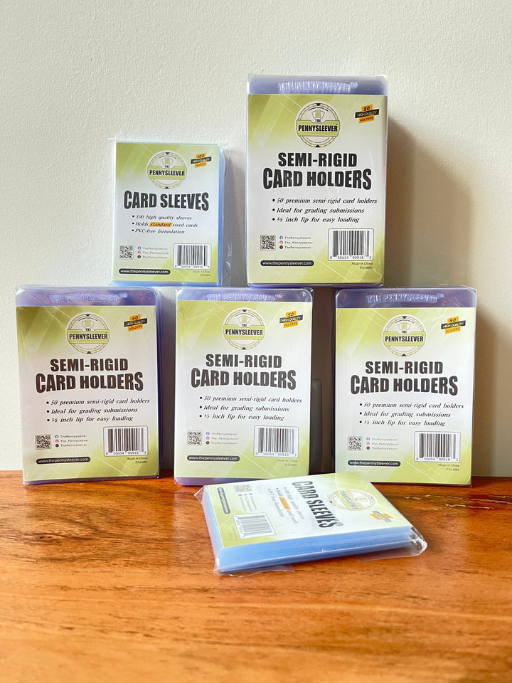 Semi-rigid card holders and card sleeves that make up The Grader bundle.