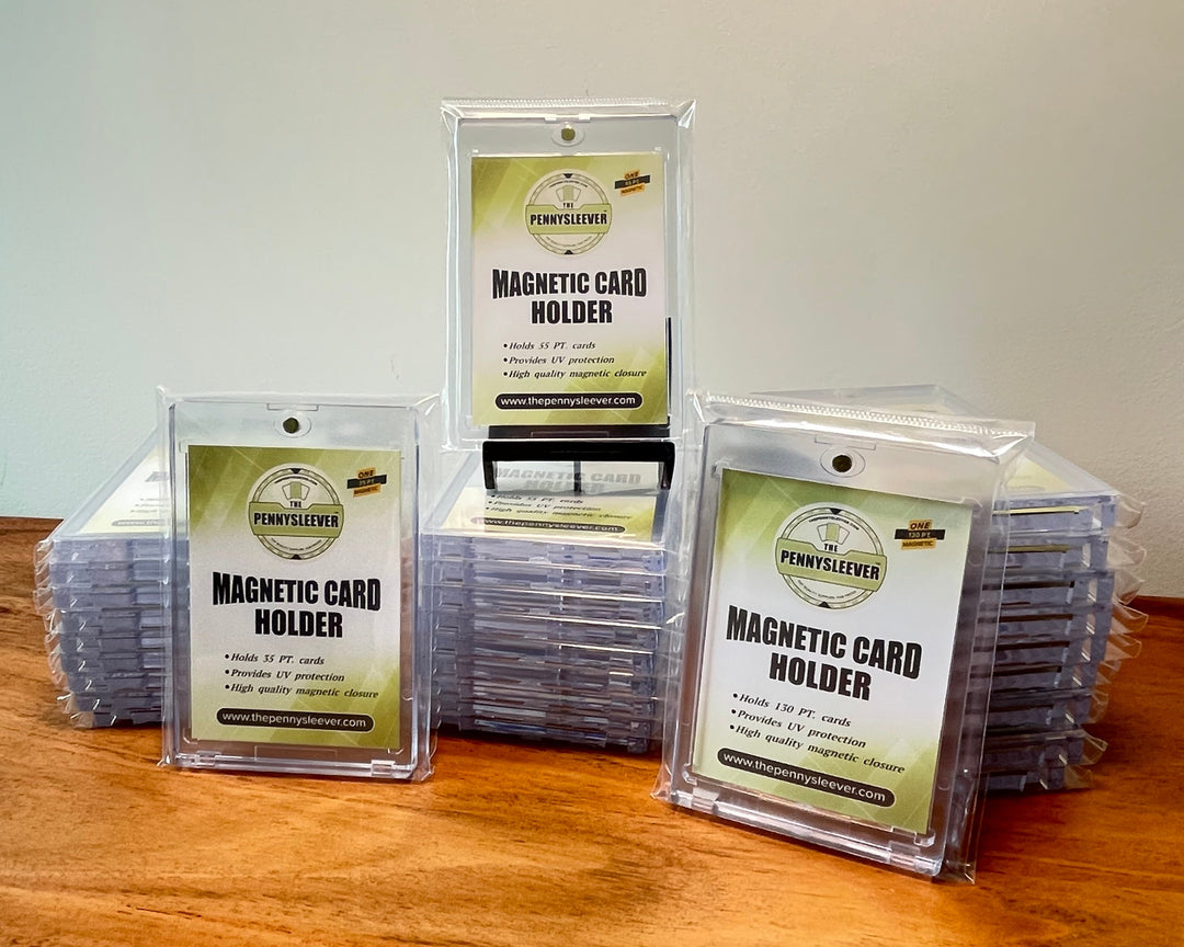 30 magnetic card holders of various sizes that make up the Show-off bundle on a wood table.