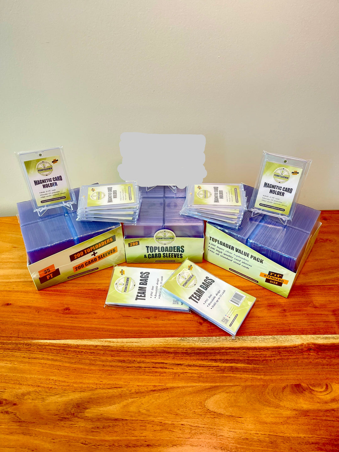 The True Fan bundle from The Pennysleever on a wood table with a white background.