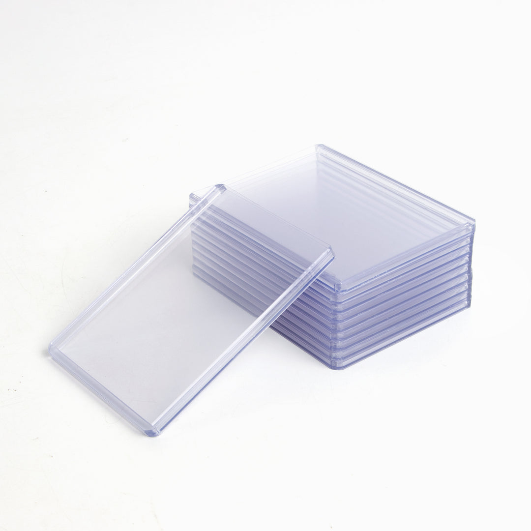 Stack of 130 point toploaders with a single toploader leaning against it.