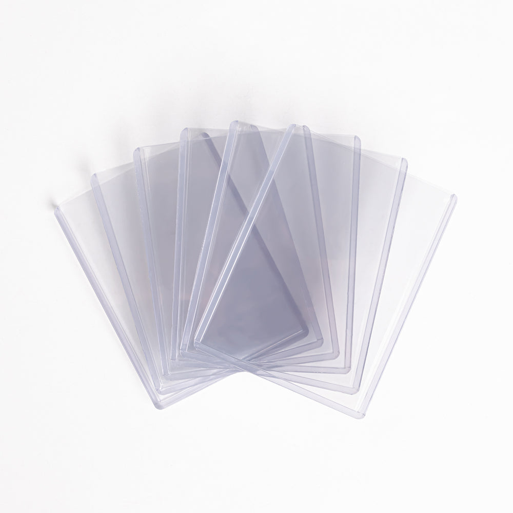 A fanned array of 260 point toploaders against a white backdrop.