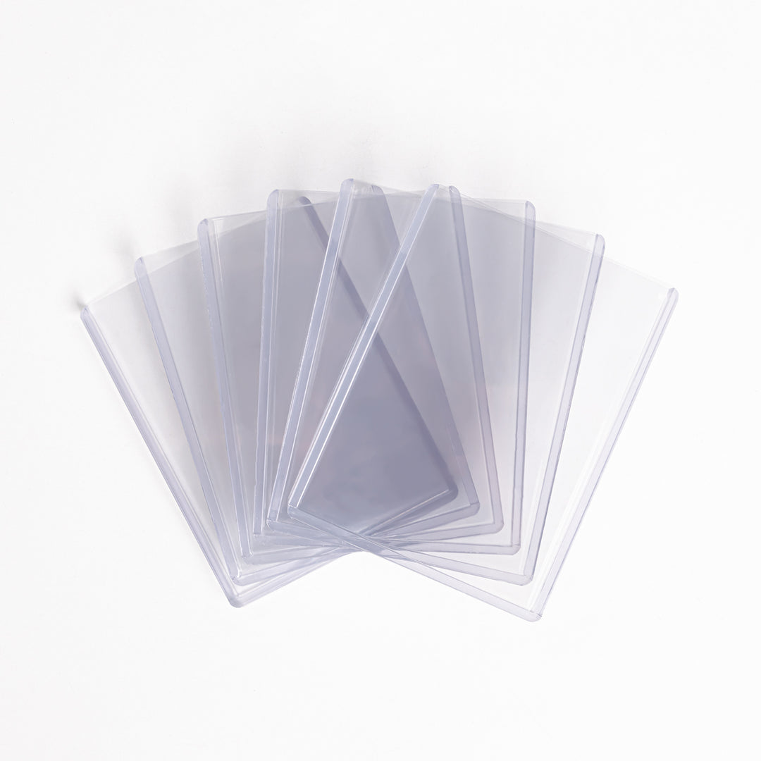A fanned array of 260 point toploaders against a white backdrop.