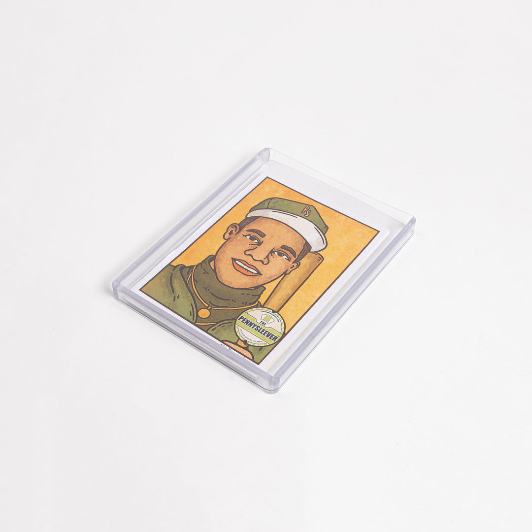 A 260 point toploader with a card inside lying on a white table.