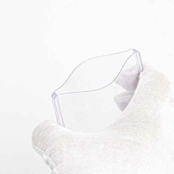 A 260 point toploader being squeezed by a white-gloved hand.