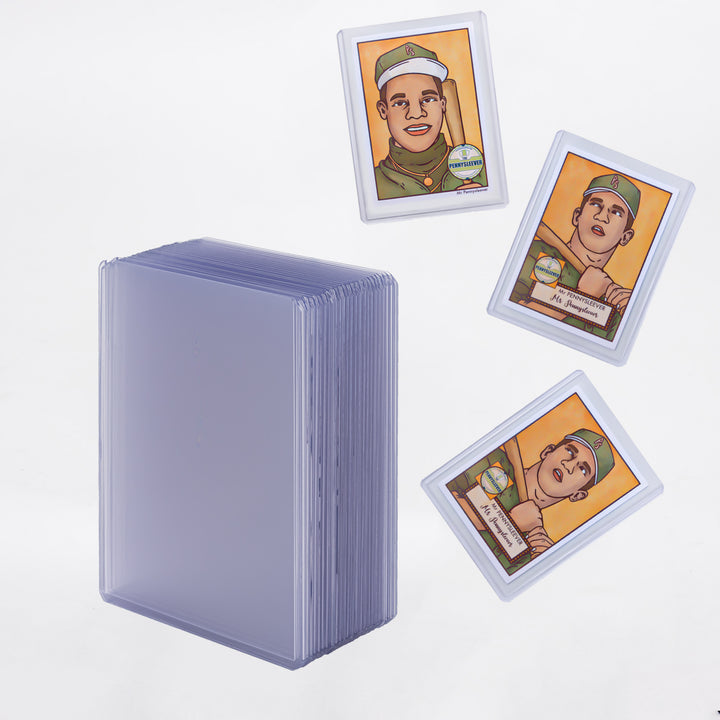 Three baseball cards in 55 point toploaders, with a large vertical stack of toploaders to the lower left.