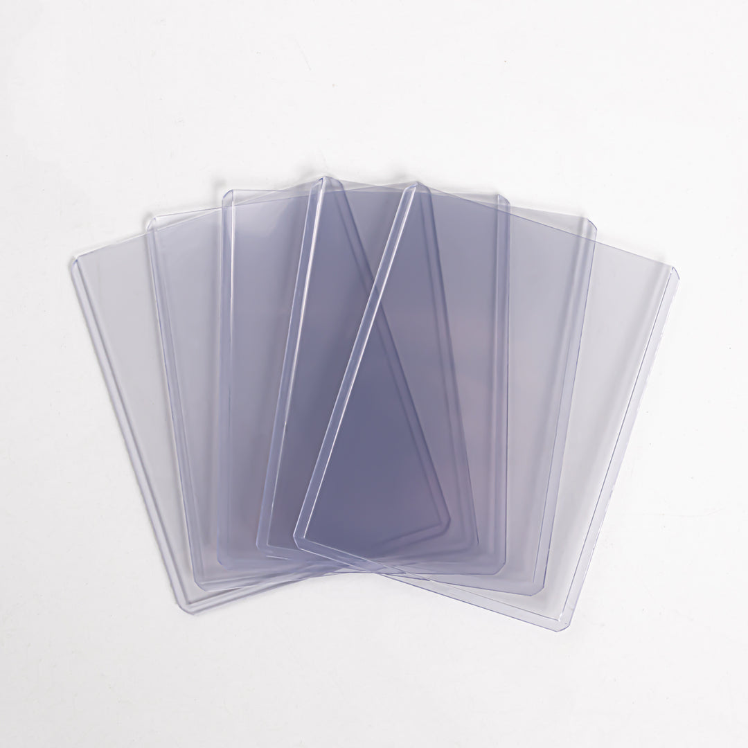 A fanned array of five 55 point toploaders against a white background.