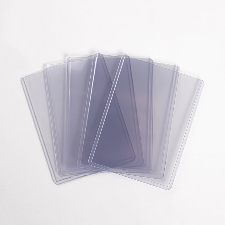 A fanned array of five 55 point toploaders against a white background.
